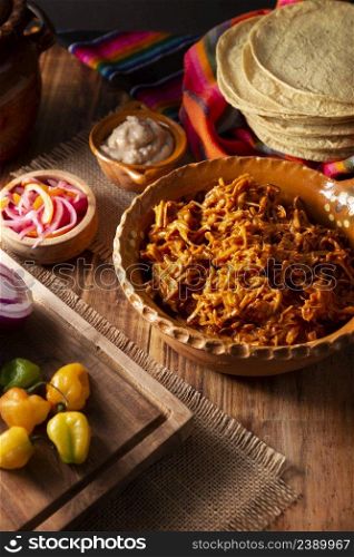 Cochinita pibil. Typical Mexican stew from Merida, Yucatan, made from pork marinated with achiote and generally accompanied with beans and red onion with habanero chili, it can be eaten in tacos.