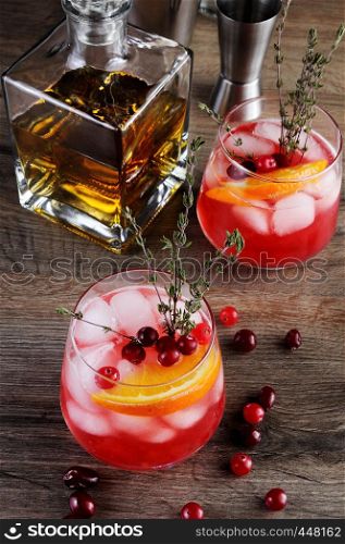 Cocktail Cranberry Orange Bourbon Smash with a spicy hint of thyme