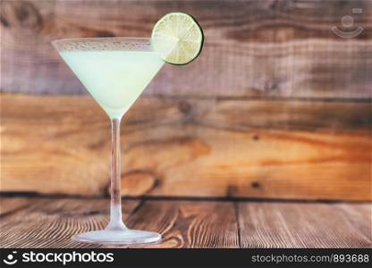 Cocktail glass of classic daiquiri on the wooden background