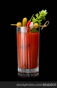Cocktail mix with vodka and tomato juice bloody mary with celery,olive,pickle and onion on black.