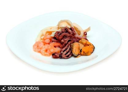 cocktail of seafood on plate on white