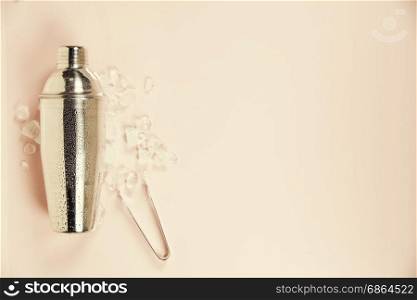Cocktail shaker on pink background