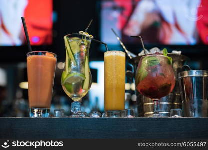 cocktails on bar background. Glasses of different cocktails on bar background