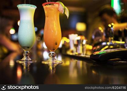 cocktails on bar background. Glasses of different cocktails on bar background