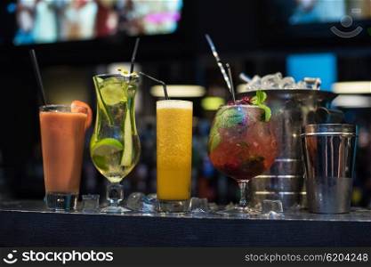 cocktails on bar background. Glasses of different cocktails on bar background