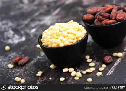 cocoa butter and beans on a table