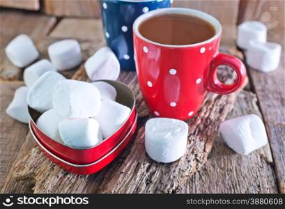 cocoa drink and marshmallows in the cups