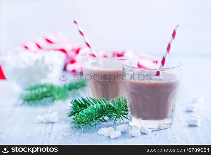 cocoa drink in glass and on a table