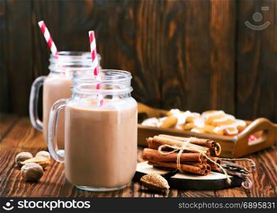 cocoa drink in glass and on a table