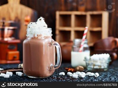 cocoa drink in glass bank and on a table