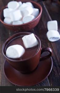 cocoa drink with marshmellow on the wooden table