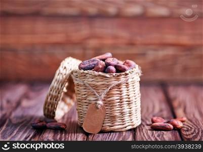 cocoa on the wooden table, cocoa beans