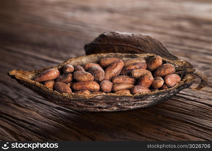 Cocoa pod on wooden background. Cocoa pod on wooden table