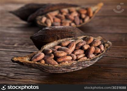 Cocoa pod on wooden table. Cocoa pod on wooden background