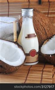 Coconut and massage oil for body on straw napkin