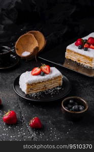 Coconut Cake slice with strawberries and blueberries