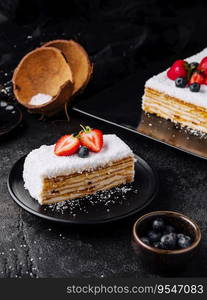 Coconut Cake slice with strawberries and blueberries