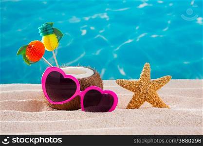 Coconut cocktail on tropical white sand beach heart shape funny sunglasses