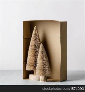 Coconut fiber Christmas trees in a box, zero waste concept, space for text
