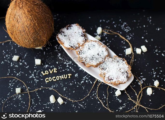 coconut muffins on a black background with words like candied fruits and coconuts. coconut muffins on a black background