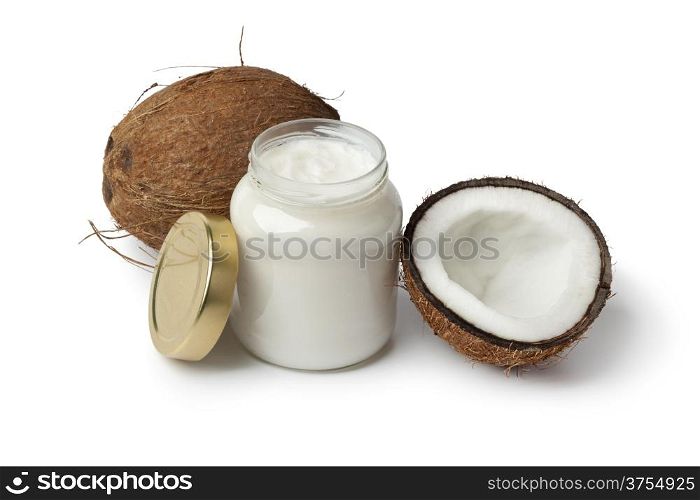Coconut oil and fresh coconut on white background
