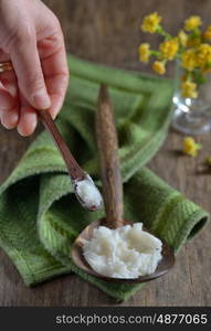 coconut oil on the wooden spoon