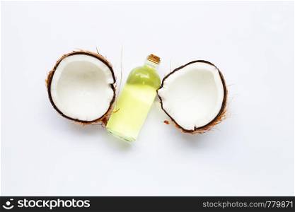 Coconut oil with coconuts on white background.
