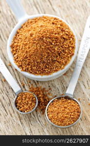 Coconut palm sugar in measuring spoons