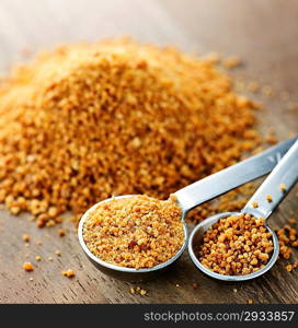 Coconut palm sugar in measuring spoons