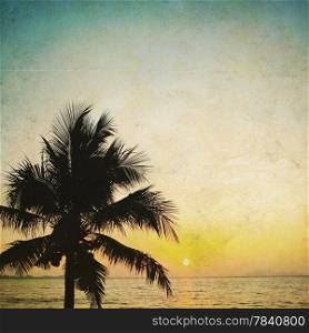 Coconut palm tree silhouetted and sunrise &#xA;in vintage background