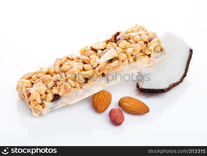 Coconut protein cereal energy bar with almonds on white background