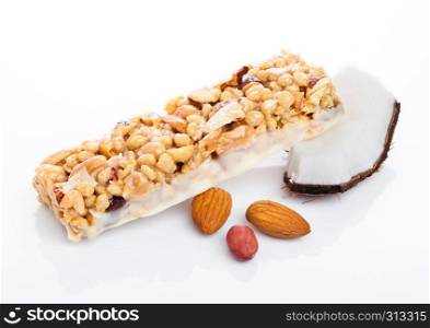 Coconut protein cereal energy bar with almonds on white background