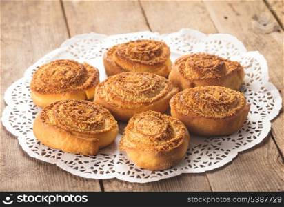 Coconut rolled buns on the wooden table