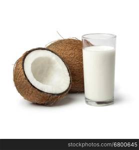 Coconut with a glass of coconut milk on white background