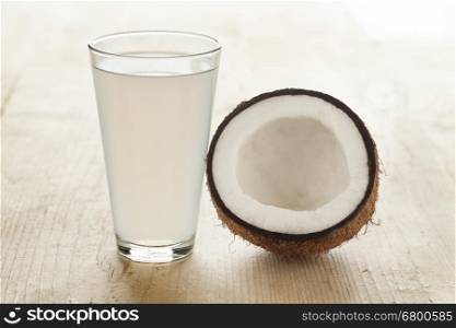 Coconut with a glass of fresh coconut water