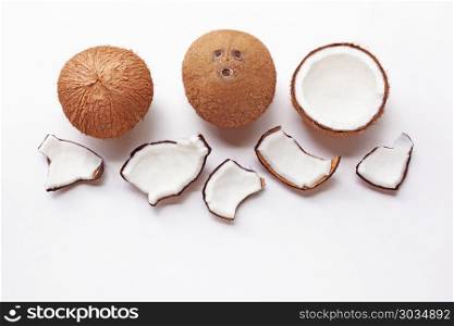 Coconuts on a white background. . Coconuts on a white background. Top view.