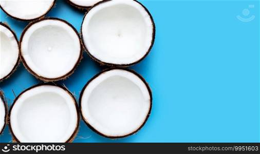 coconuts on blue background. Copy space