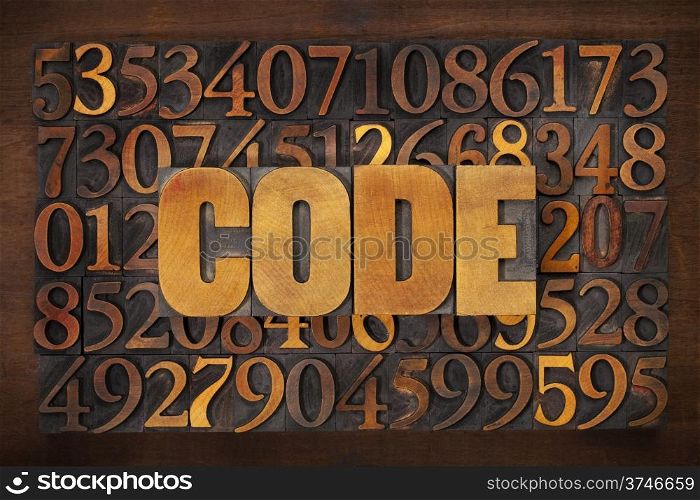 code word in vintage letterpress wood type against number background