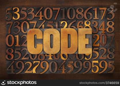 code word in vintage letterpress wood type against number background