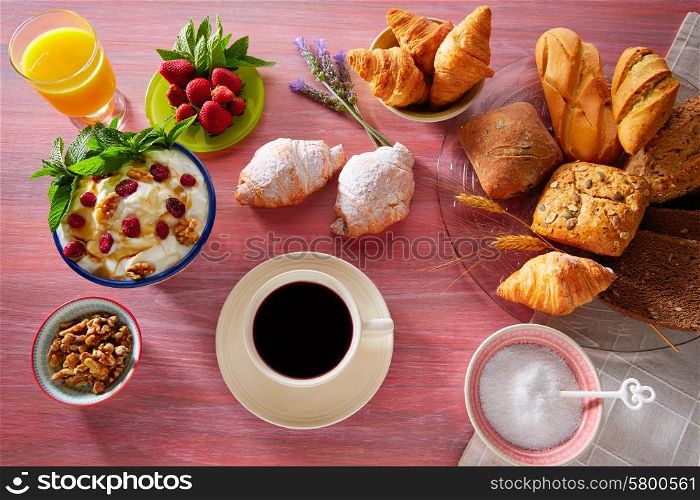 Coffe breakfast with orange juice croissant bread and strawberries