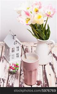 Coffe Latte and tulips on the shabby chic table. The Coffe Latte
