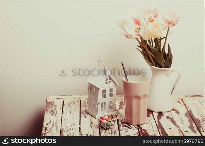 Coffe Latte and tulips on the shabby chic table. The Coffe Latte