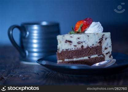 Coffee and chocolate and cheese cake on distressed wood background