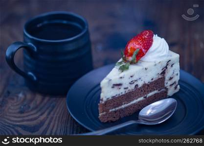 Coffee and chocolate and cheese cake on distressed wood background