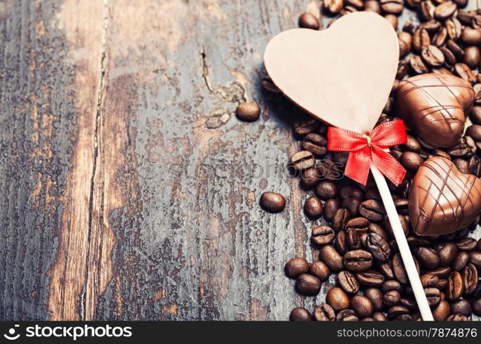 Coffee and chocolate on grunge wooden background - Valentine&rsquo;s day and love concept