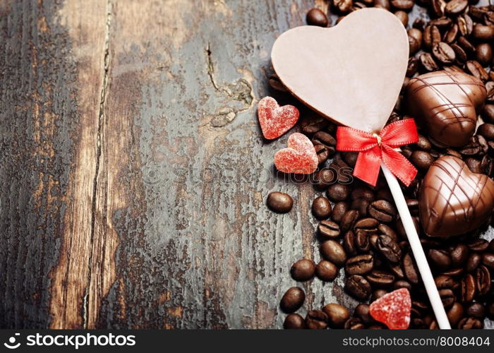 Coffee and chocolate on grunge wooden background - Valentine&rsquo;s day and love concept