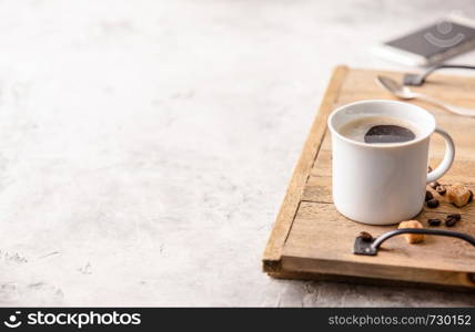 Coffee and smartphone on light grey background, coffee break concept