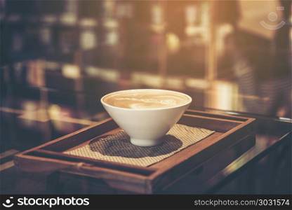 Coffee and workplace atmosphere, vintage filter image