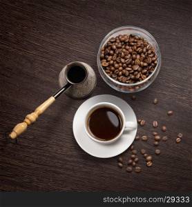 coffee attributes on a wooden background. Top view of coffee attributes on a wooden background