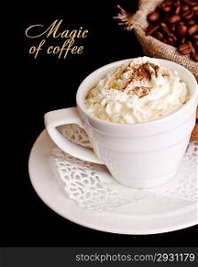 Coffee background and white cup isolated in black